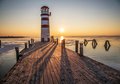 Fototapeta - latarnia morska, molo, zachód słońca